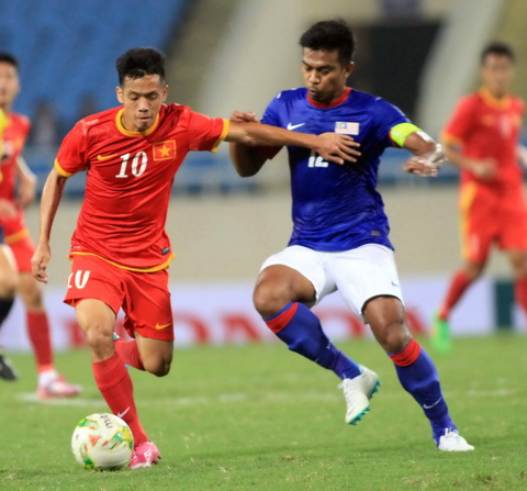 Đội tuyển Việt Nam (trái) quyết thắng Malaysia một lần nữa trên sân Mỹ Đình.