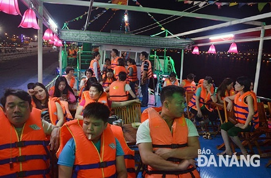 Passengers wearing lifejackets whilst on a boat trip