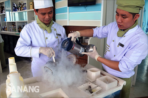 Chef Coi (left) making ice cream with liquid nitrogen