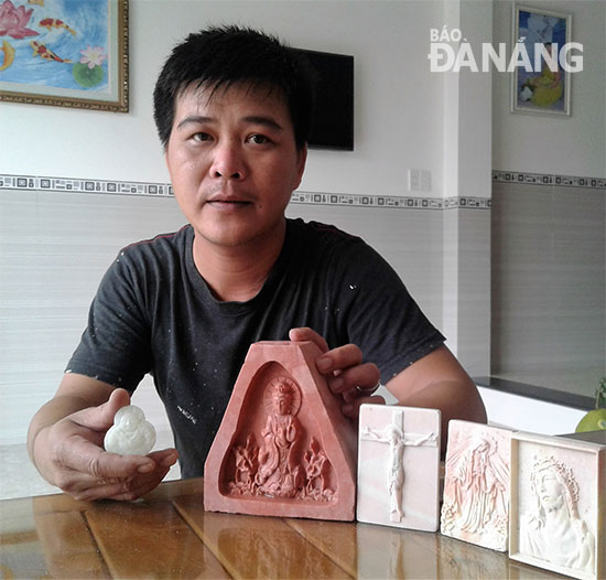 Mr Hanh and his relief entitled ‘Guan Yin Sitting on a Lotus’