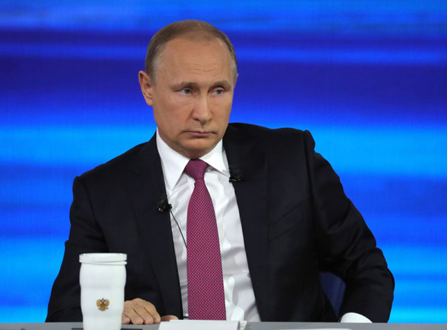 Tổng thống Vladimir Putin bác bỏ cáo buộc Nga can thiệp vào cuộc bầu cử tổng thống Mỹ.  Ảnh: AP