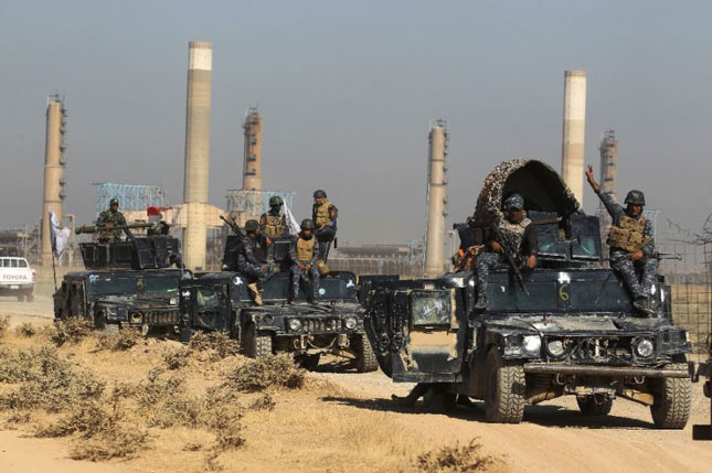 Lực lượng quân đội chính phủ Iraq tiến về Kirkuk. 	Ảnh: AFP