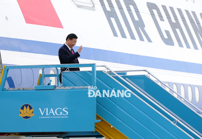 President Xi Jinping stepping down from an airplane at the city’s airport