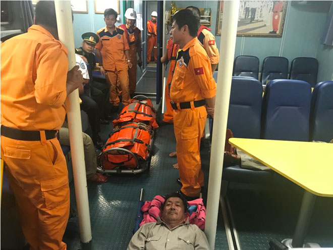 The distressed fishermen receiving first aid onboard rescue ship SAR 274