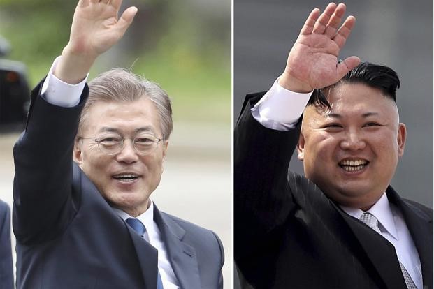 Tổng thống Hàn Quốc Moon Jae-in (trái) và nhà lãnh đạo Triều Tiên Kim Jong-un (Ảnh: Getty)