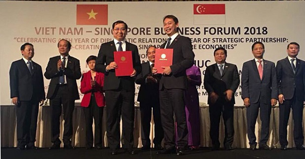 Chairman Huynh Duc Tho (first row, left) at the forum