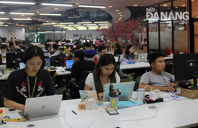 Employees working at the city-based Asian Tech company 
