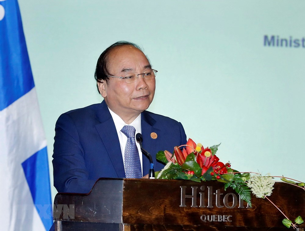 Thủ tướng Nguyễn Xuân Phúc phát biểu tại Tọa đàm Doanh nghiệp Việt Nam-Canada. (Ảnh: Thống Nhất/TTXVN)