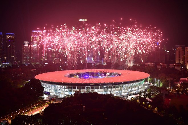 Fireworks explode over the Gelora Bung Karno main stadium during the opening ceremony of the 2018 Asian Games in Jakarta on August 18, 2018. (Source: AFP)