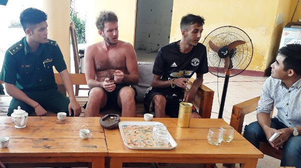 The British tourist (2nd left) has been rescued after getting lost on Son Tra Peninsula for 2 days