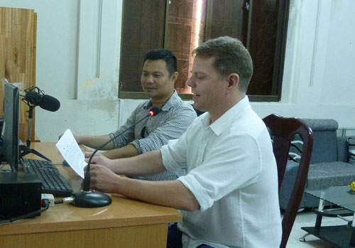Mr Duy and a foreign volunteer who is recording his voice