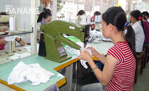 Workers at a local textiles and garments company