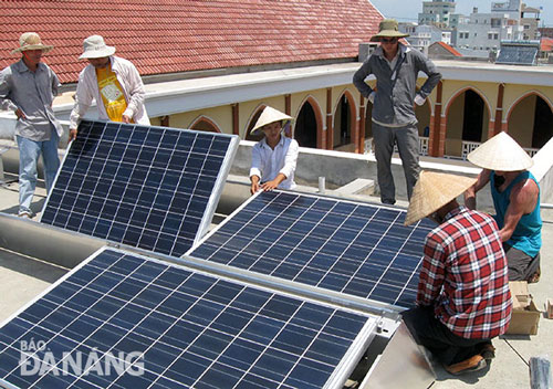 Fitting solar panels made at a local social enterprise