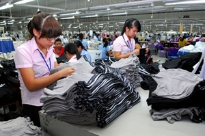 Workers put the final touches on clothes at French-owned Scavi Hue Garment Company in Hue