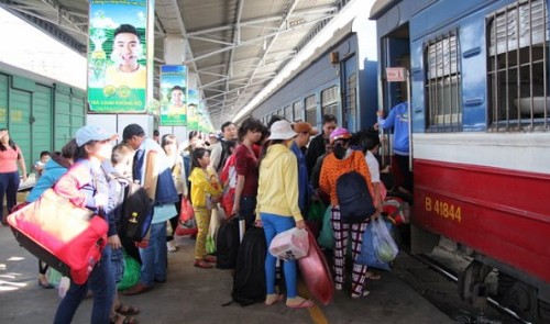 Passengers board a Viet Nam Railways train at Saigon Station in Ho Chi Minh City.
