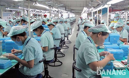 Workers at an electronic components factory in Hoa Khanh Industrial Park 