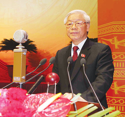 Tổng Bí thư Nguyễn Phú Trọng đọc Báo cáo của Ban Chấp hành Trung ương Đảng khóa XI về các văn kiện trình Đại hội XII của Đảng.             Ảnh:  TTXVN