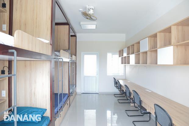 Each room features spacious bunk beds, a bookshelf, and working desks.