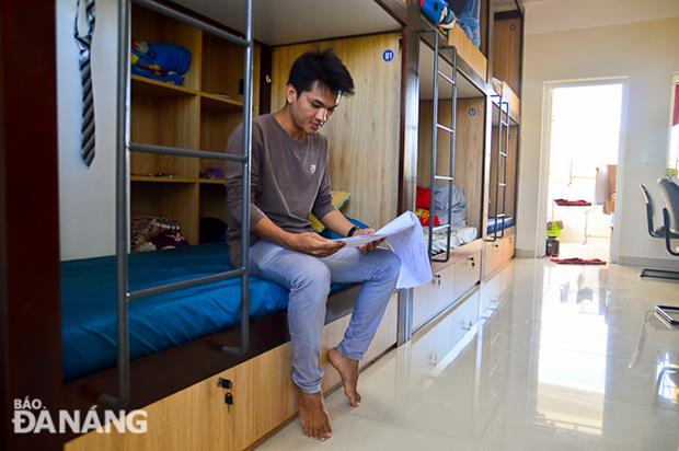 Bouttivong Souksakhone, a Lao student of the University, being in his new living space.