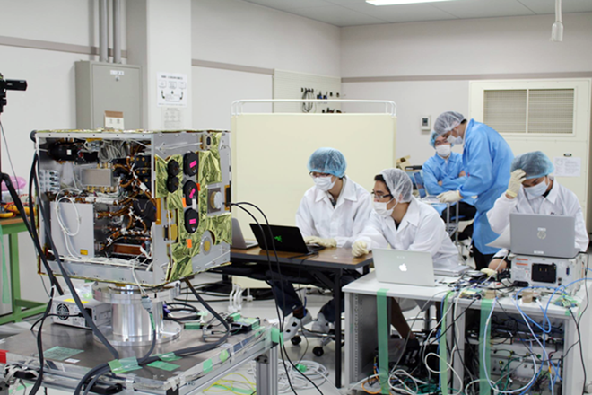 Vietnamese engineers work to develop MicroDragon satellite. (Photo: )