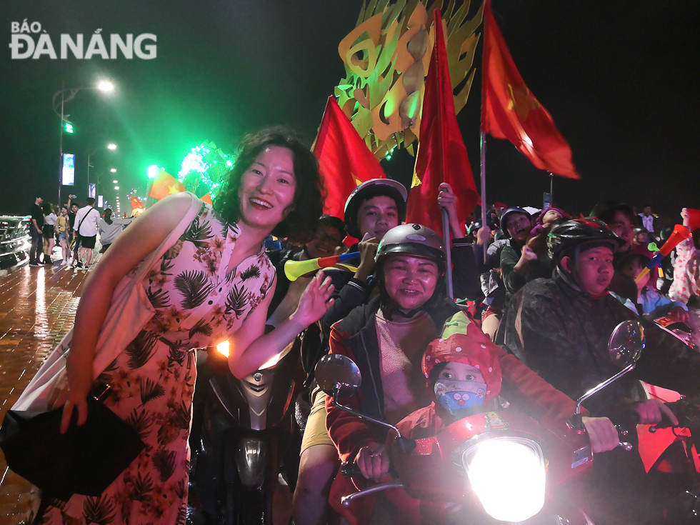 A South Korean tourist also celebrating the Vietnamese team’s historic win