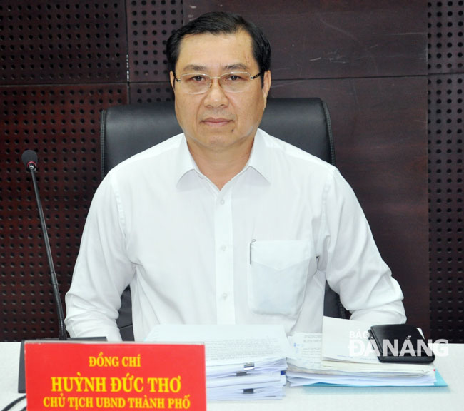 Chủ tịch UBND thành phố Huỳnh Đức Thơ chủ trì phiên họp. Ảnh: TRÂM ANH