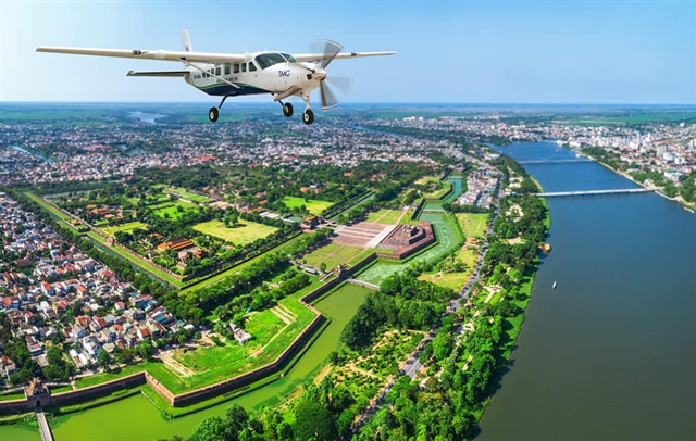 An aerial view of the royal citadel and the Hương River in Huế City. — Photo provided by local Department of Tourism Read more at http://vietnamnews.vn/life-style/518902/new-flight-connects-the-neighbours-of-hue-da-nang.html#IRzO73ft2g3cOQkB.99