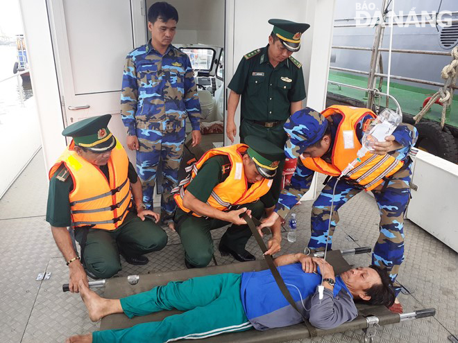 Giving initial first aid to an injured fisherman