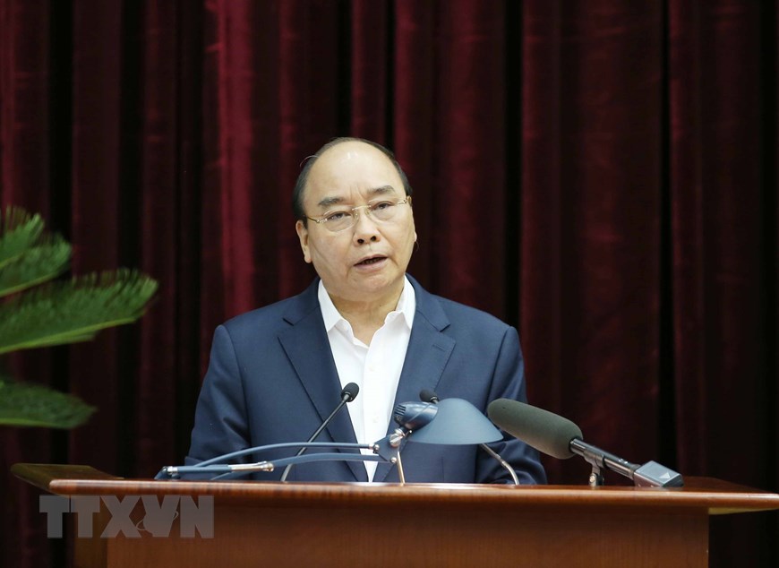 Ủy viên Bộ Chính trị, Thủ tướng Chính phủ Nguyễn Xuân Phúc trình bày báo cáo tại hội nghị. (Ảnh: Phương Hoa/TTXVN)