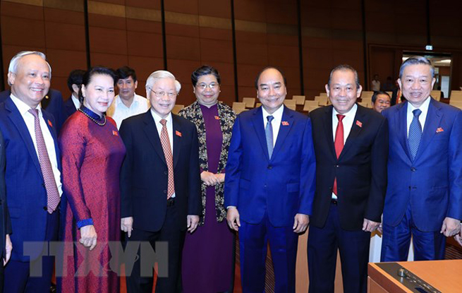  Tổng Bí thư, Chủ tịch nước Nguyễn Phú Trọng với các đồng chí lãnh đạo Đảng, Nhà nước tại phiên khai mạc. (Ảnh: TTXVN)
