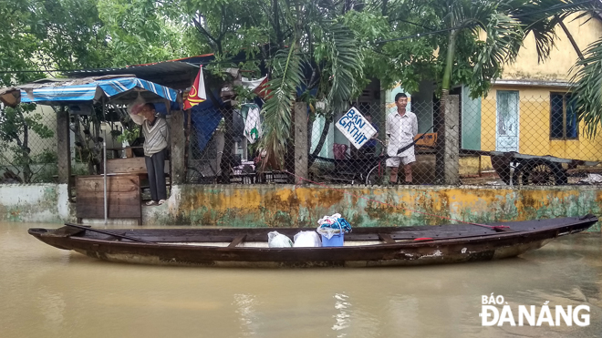 Small boats are the only means of transportation for people in flooded Hoa Vang District