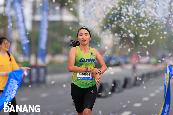 Vietnamese runner Pham Thi Binh wins the women's 42km full marathon event when she crosses the finish line in a time of 3 hours 10 mins 32 secs.
